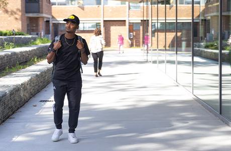 shot of student walking on campus